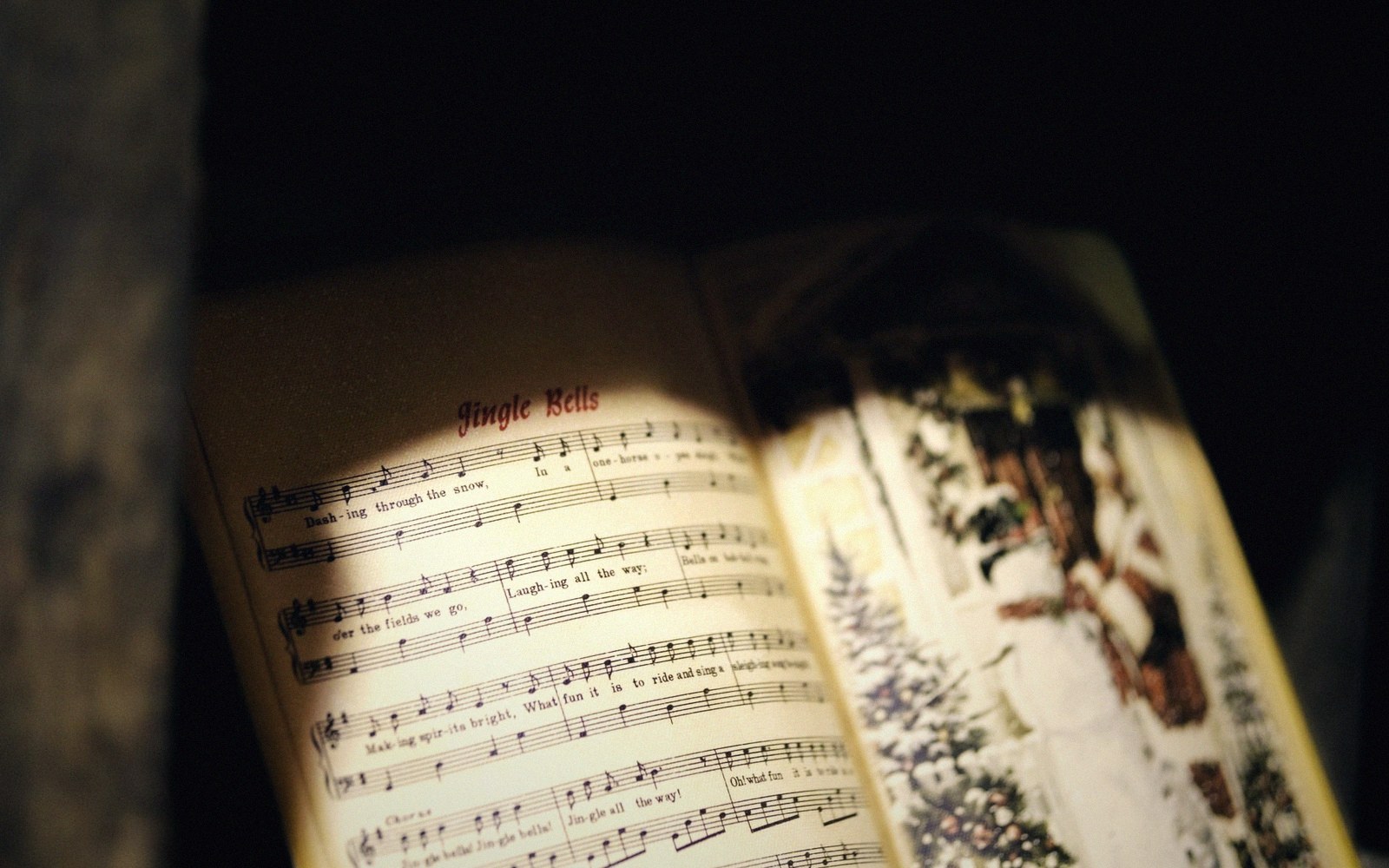 A song booklet with lyrics printed in two scripts